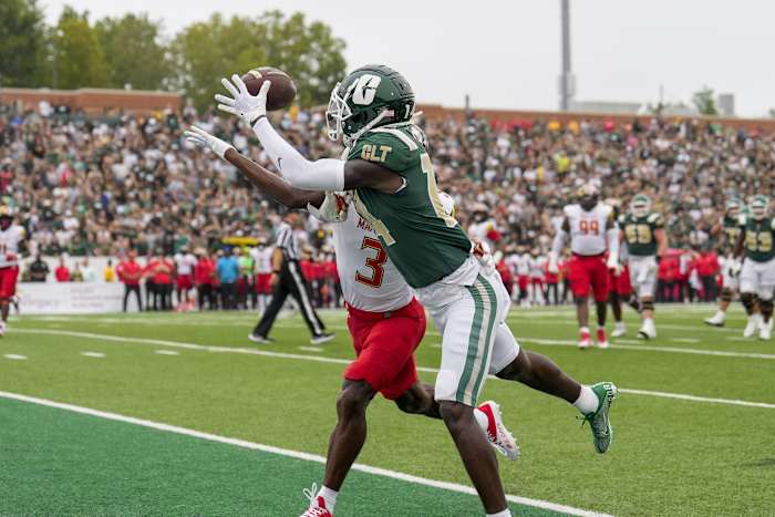 Sep 10, 2022; Charlotte, North Carolina, USA; Charlotte 49ers wide receiver Grant DuBose (14) makes a touchdown catch defended by Maryland Terrapins defensive back Deonte Banks (3) during the first quarter at Jerry Richardson Stadium. Mandatory Credit: Jim Dedmon-USA TODAY Sports